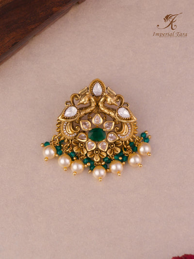 Details of peacock design yahoo pendant set in green beads