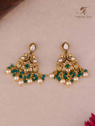 Detail view of peacock design Moissanite stone green pendant set earrings