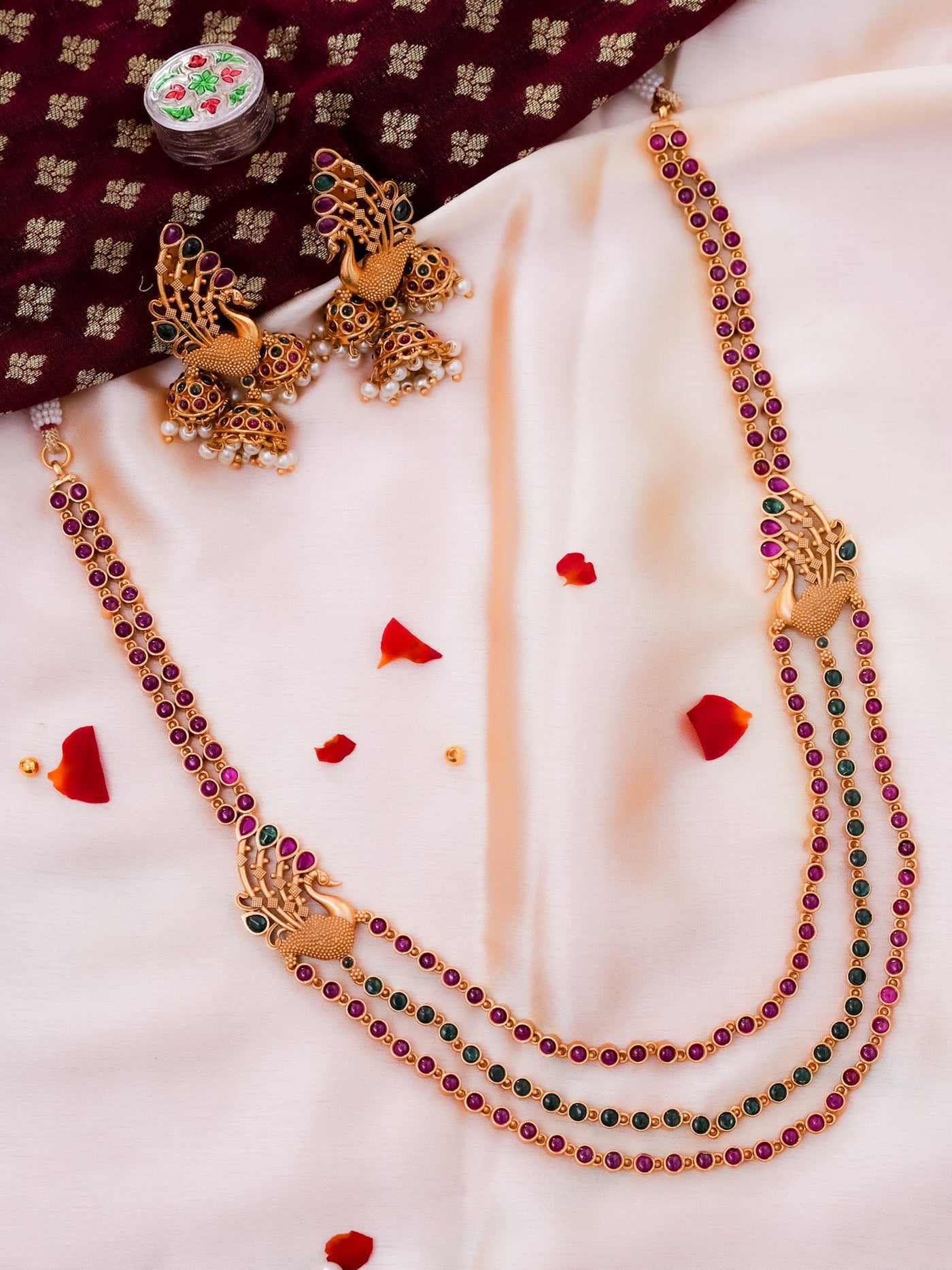 Three layered peacock short haram with beads jhumkas hanging to the earrings in real kemp, temple Jewellery 