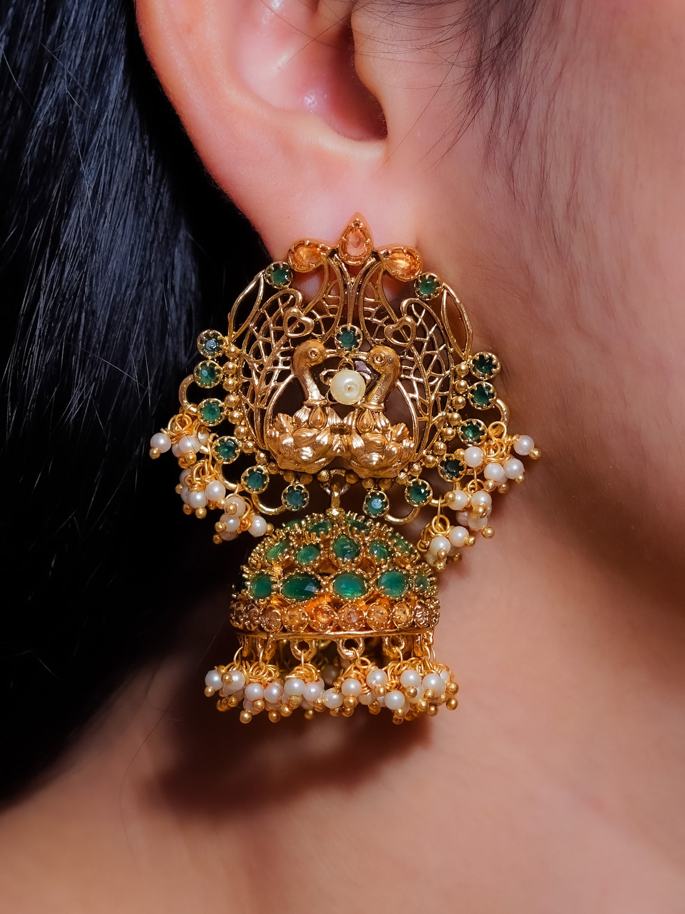 Heavy peacock earrings with jhumkas and cluster pearl danglers in temple Jewellery